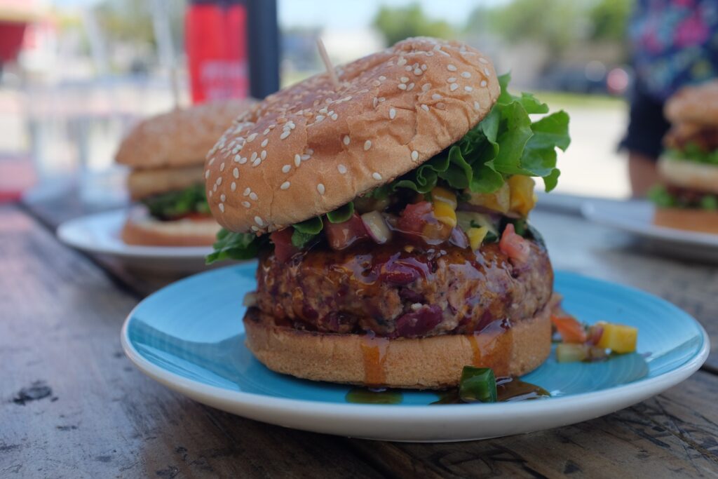 How to go vegan step 9: Focus on what you can eat. Picture of a vegan burger with relish.